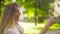 Portrait of young attractive woman against trees