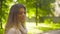 Portrait of young attractive woman against trees