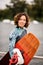 Portrait of young attractive woman in wetsuit with bright wakeboarding