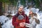 Portrait of young babywearing family with his son in baby sling, winter weekend outdoor