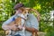 Portrait of young basenji and senior man