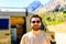 Portrait of young bearded trucker near his truck vehicle house