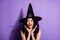 Portrait of young beautiful amazed smiling girl witch see big sale discount black friday isolated on violet color