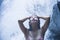 Portrait of young beautiful Asian girl looking pure and enjoying nature beauty with face wet under amazing beautiful natural water