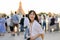 Portrait young beautiful asian woman smiling while travel at Wat Arun sunset view point, Bangkok, Thailand