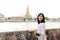 Portrait young beautiful asian woman smiling while travel at Wat Arun sunset view point, Bangkok, Thailand