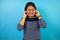 Portrait of Young beautiful asian women with blue isolated background