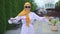 Portrait of a young beautiful blind woman in a hijab with a cane in the Park