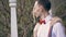 Portrait, young beautiful couple newlyweds hugging, the bride straightens the red bow tie on her fiance. looking at each