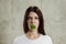 Portrait of a young, beautiful girl holding a broccoli in her mouth.. The concept of a healthy diet, detox, weight loss, diet,