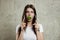 Portrait of a young, beautiful girl holding a broccoli in her mouth.. The concept of a healthy diet, detox, weight loss, diet,