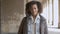 Portrait of young beautiful mixed race woman with afro haircut walking