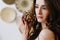 Portrait of a young beautiful woman  in authentic original interior. Beautiful young brunette posing in the studio.