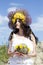 Portrait of young beautiful woman with circlet of flowers on her