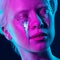 Portrait of young beautiful woman with neon, fluid tears from eyes. Concept of fashion and beauty, emotions and feelings