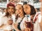 Portrait of young beautiful women posing outdoors