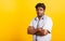 Portrait young black man standing cross arms