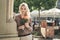 Portrait of a young blond woman with a bunch of roses