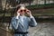 Portrait of young blonde girl model with glasses in park outdoors on an autumn day