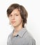 Portrait of young boy in grey shirt