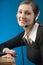 Portrait of young business woman or secretary with headset