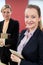 Portrait Of Young Businesswoman With Female Mentor In Office