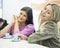 Portrait of young businesswomen smiling at cafeteria table