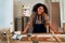 Portrait of young carpenter woman or wood worker stand with confidence action in workplace area with equipment are on table