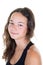 Portrait of young caucasian teenage girl in black shirt casually sitting near white wall