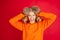 Portrait of young caucasian woman with bright emotions isolated on red studio background