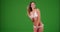 Portrait of young Caucasian woman modeling white bikini on green screen