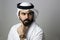 Portrait Of A Young Confident Arab Businessman Wearing UAE Emirati Tradational Dress