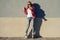 Portrait of young cool girl, shod in rollerblades holding chocol