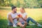 Portrait of Young couple enjoying in the park at sunset. Concept romantic and love. Warm tone