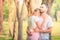 Portrait of Young couple enjoying in the park at sunset. Concept romantic and love. Warm tone