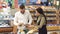 Portrait of a young couple with a full trolley of products in the supermarket.