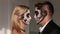 Portrait of a young couple in the Halloween mask. Close-up.