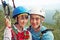 Portrait of young couple in love climbers. man and woman hanging on a rock on the ropes. climbing, extreme sport