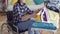 Portrait of a young disabled woman housewife doing homework ,Ironing clothes