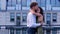 Portrait of young elegant couple wife and husband standing outdoor on roof having romantic date together. Love and