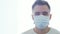 Portrait of young and emotional bearded man in protection medical mask. pandemic, health care, medicine and