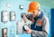 Portrait of young engineer repairing equipment at control room