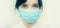 Portrait of a young European woman in a protective disposable medical mask. Concept of caronavirus Cavid 19 and human quarantine.