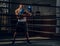 Portrait of young experienced boxer on the ring