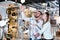 Portrait of young family couple looking lamp in shop