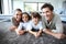 Portrait of young family at home lying on soft carpet