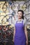 Portrait of young female mechanic in bicycle store, Beijing