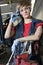 Portrait of a young female mechanic wearing protective eyewear in garage