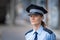 portrait of a young female policewoman in uniform
