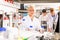 Portrait of young female scientist near laboratory equipment at biochemical lab